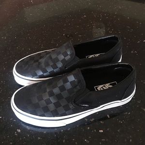 Black checkered slip on vans